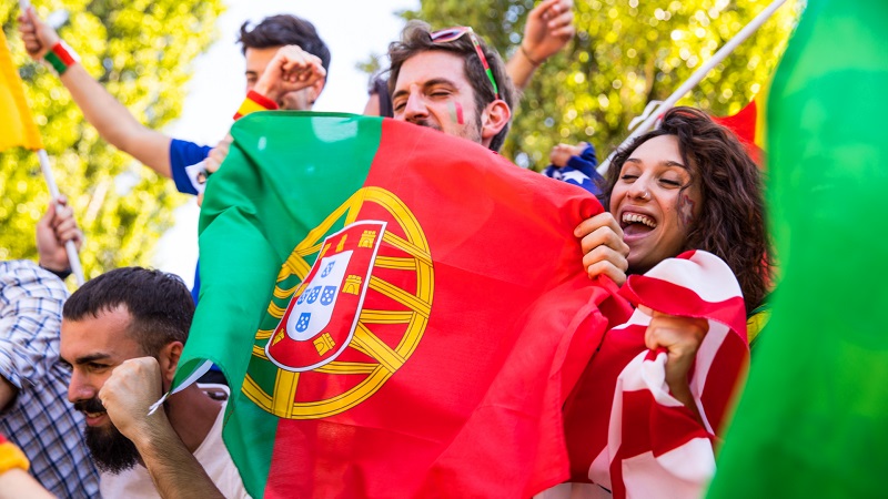 People enjoying holding Portugal flag