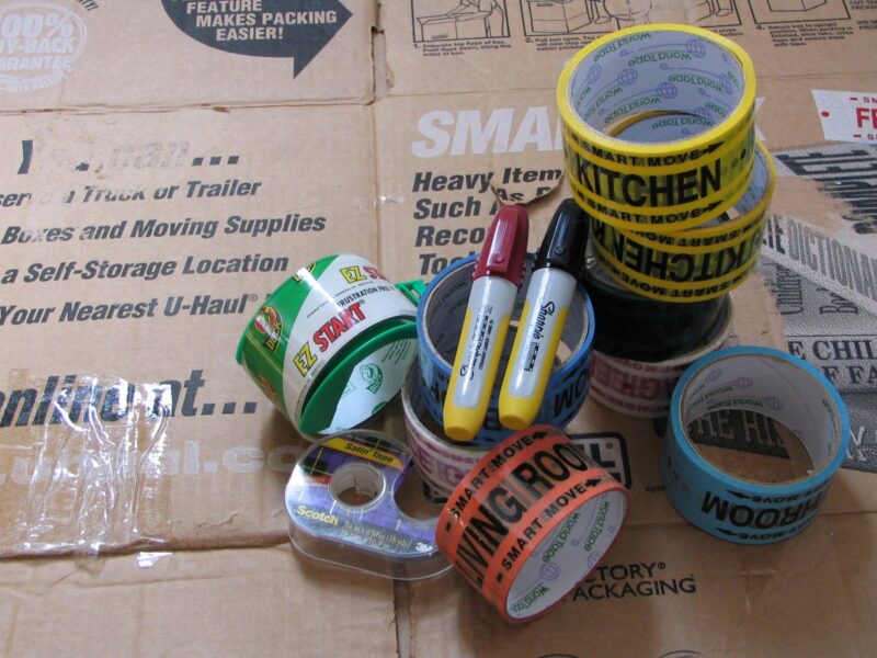 box labeling and packing items, including tape, markers and sturdy boxes