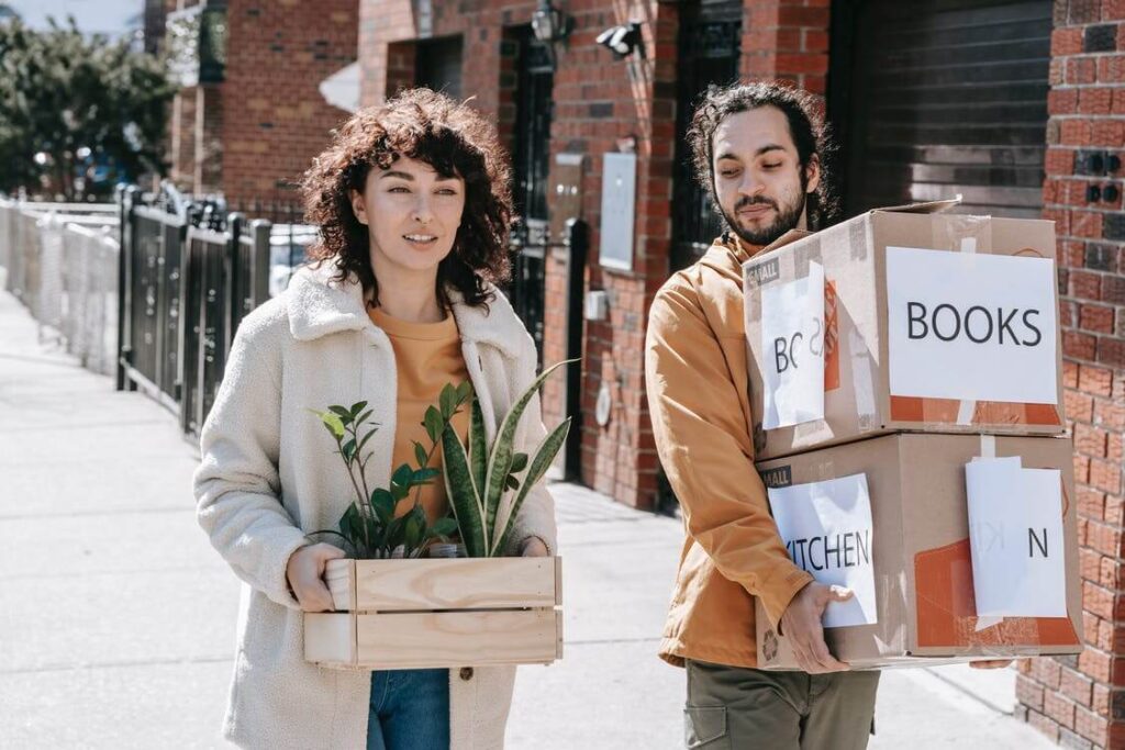 couple carrying boxes