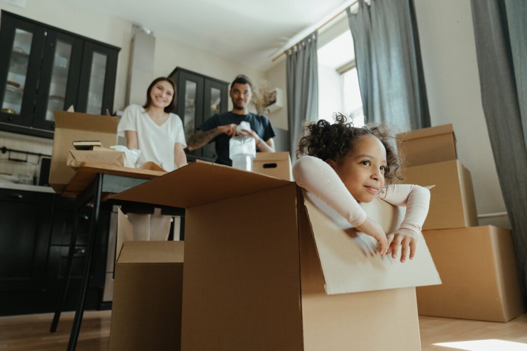 family unpacking in kitchen