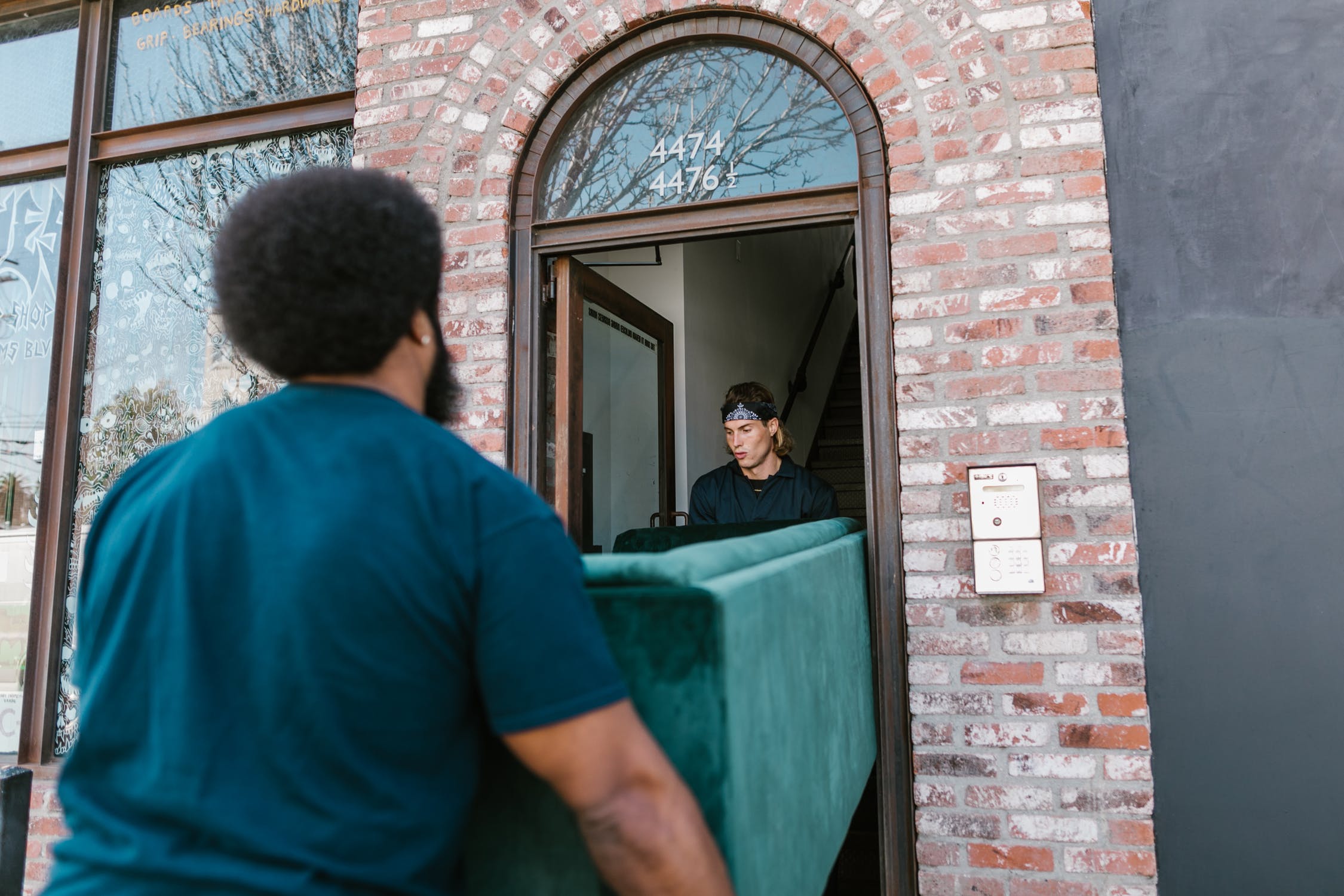 movers carrying a sofa