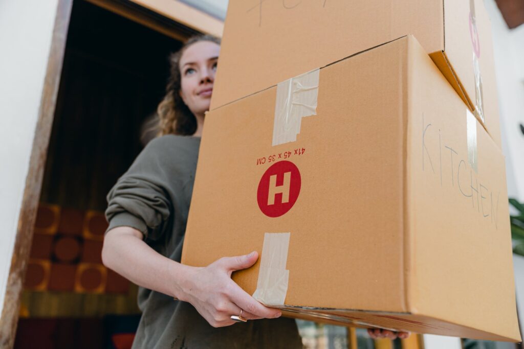 woman carrying boxes