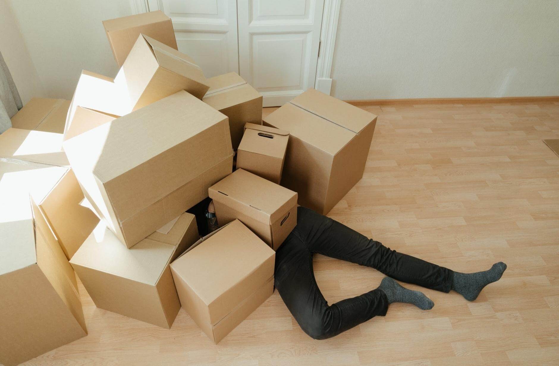 Brown Cardboard Boxes on Brown Wooden Floor