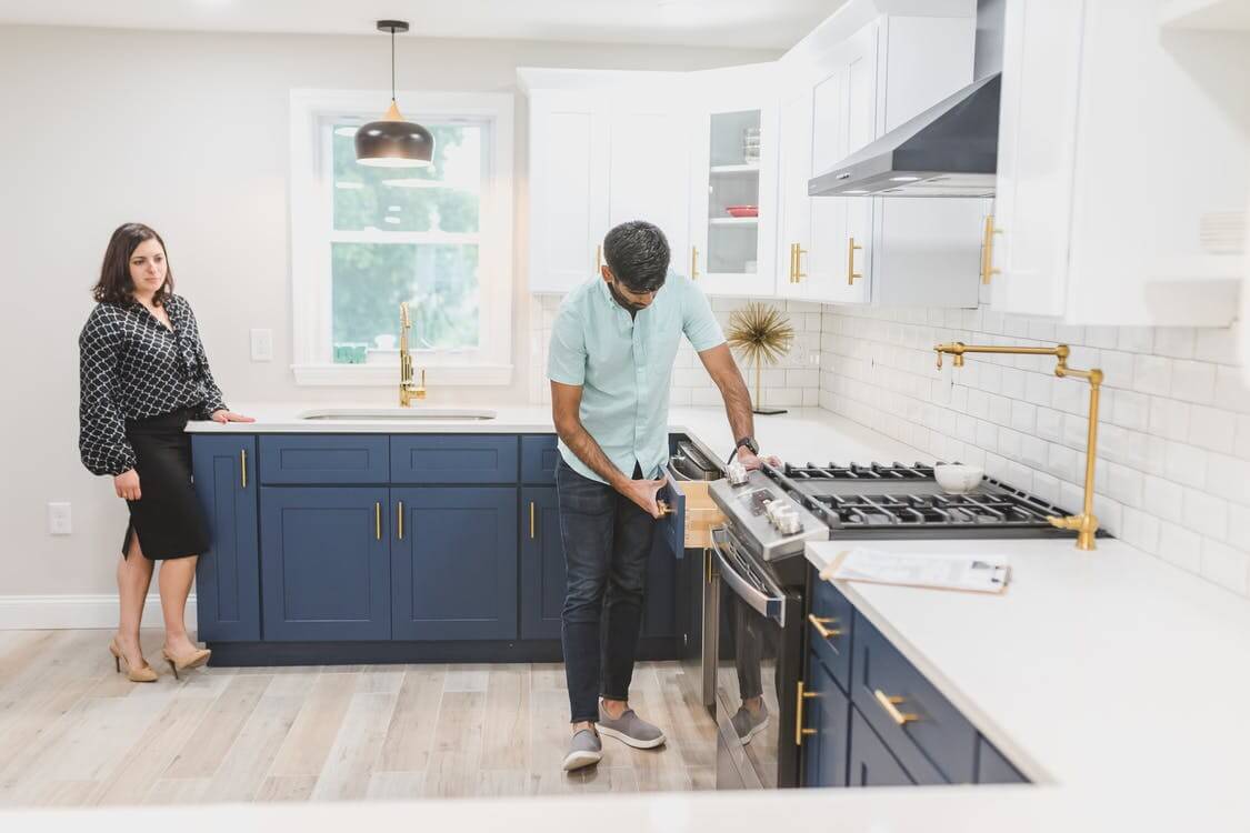 A Man Inspecting the Kitchen Drawer Crop unrecognizable woman placing blank paper in envelope