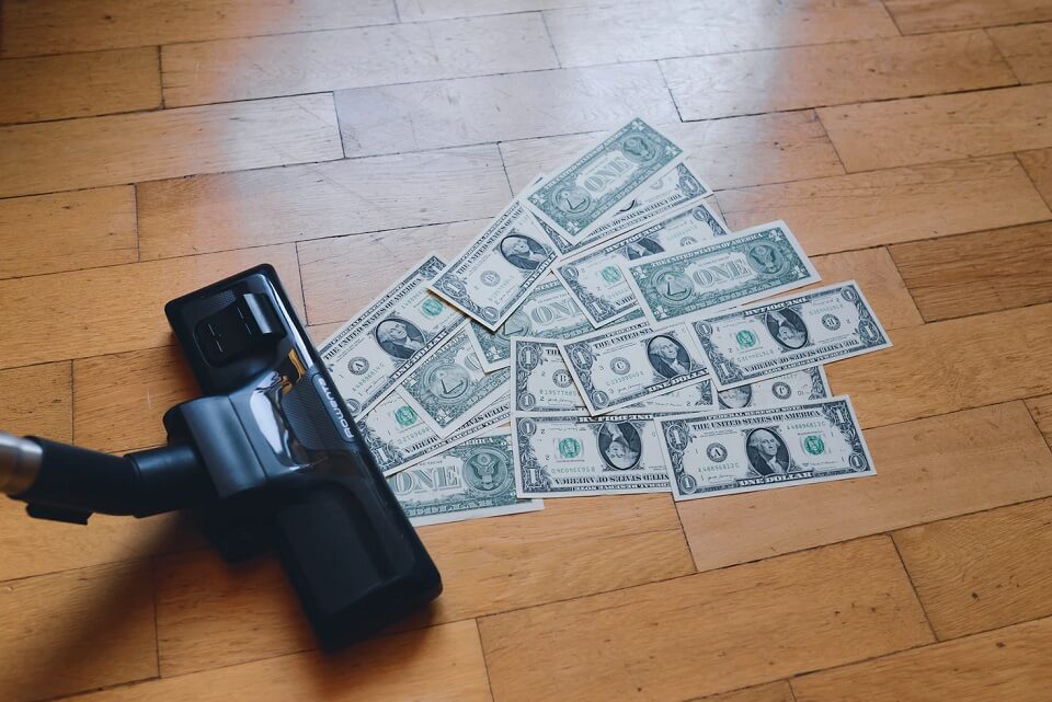 vacuuming dollar bills