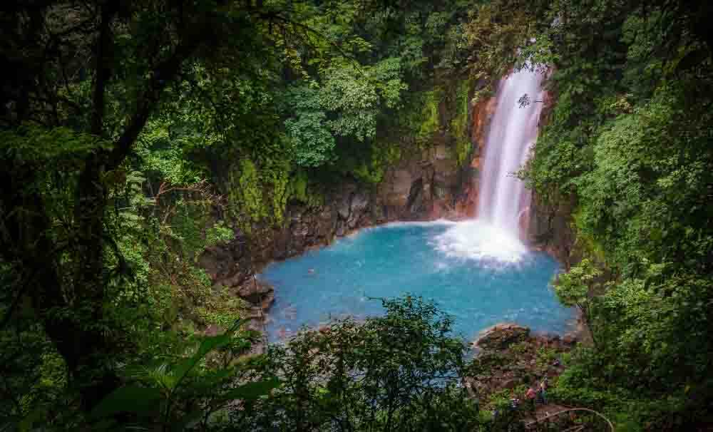 Celestial blue waterfall in volcan tenorio national park costa rica