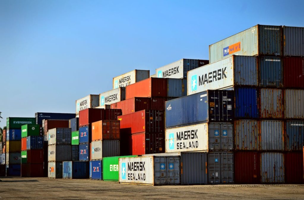 yard of storage containers of different colors